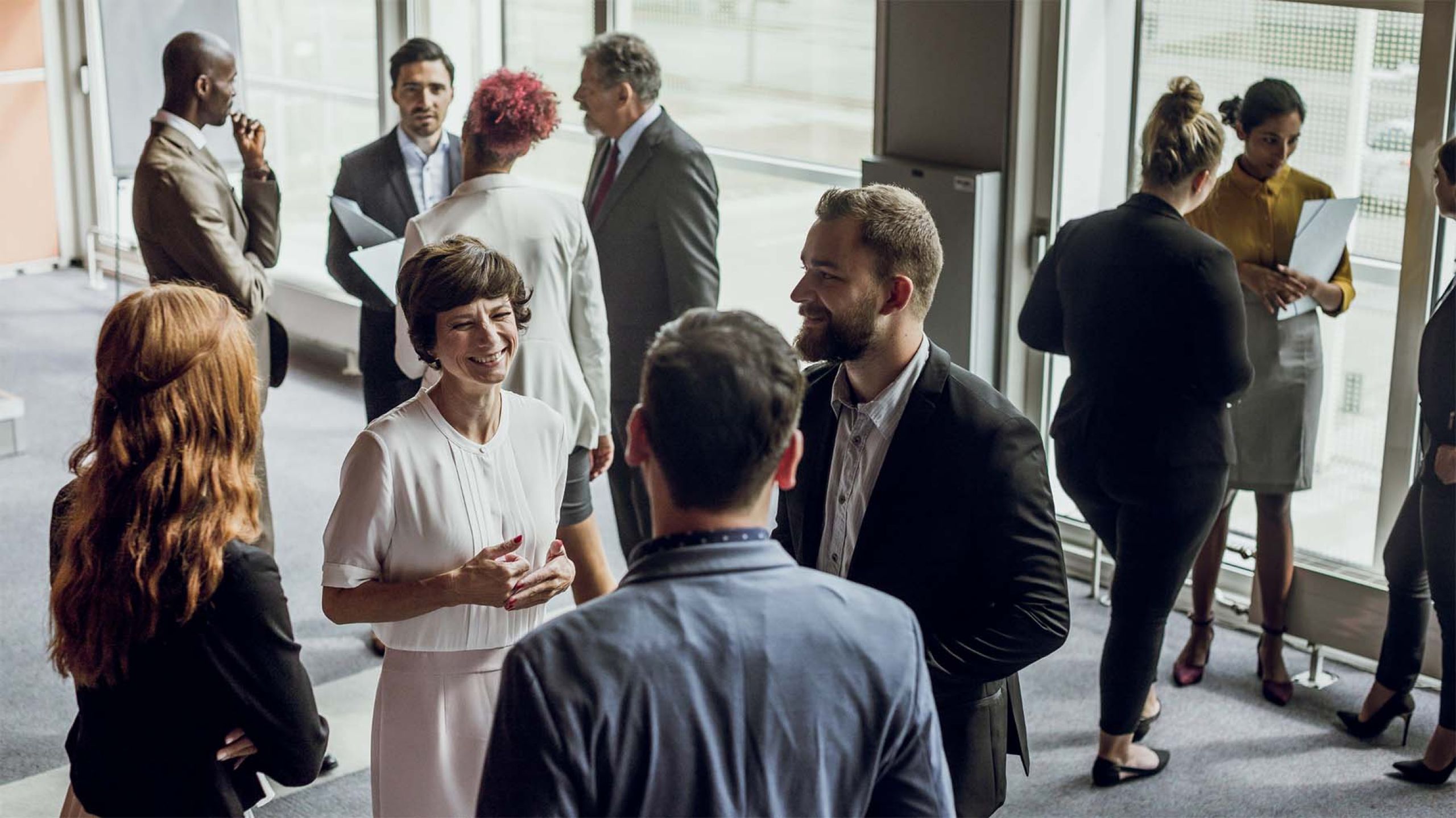 group of business professionals having fun at event